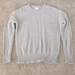 Gray knit sweater.